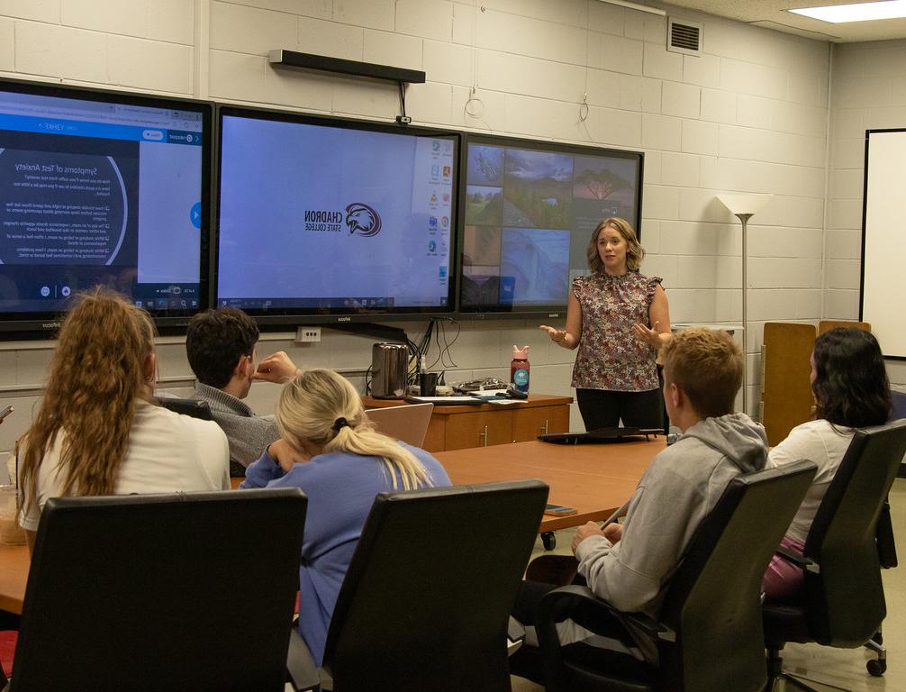 Woman instructing a small group of students